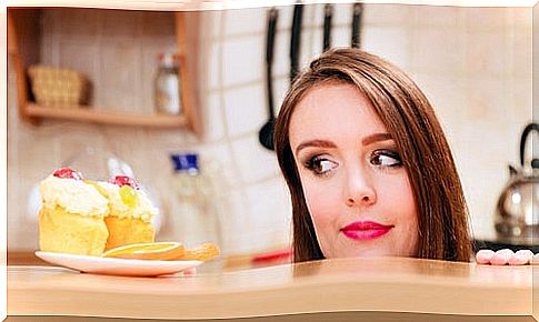 Woman looking at some cakes.