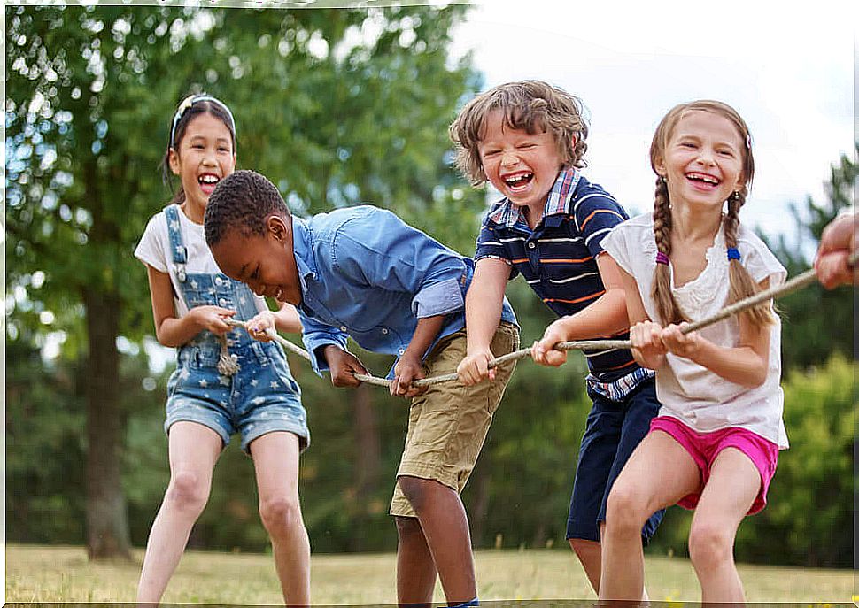 Children playing rope in a park