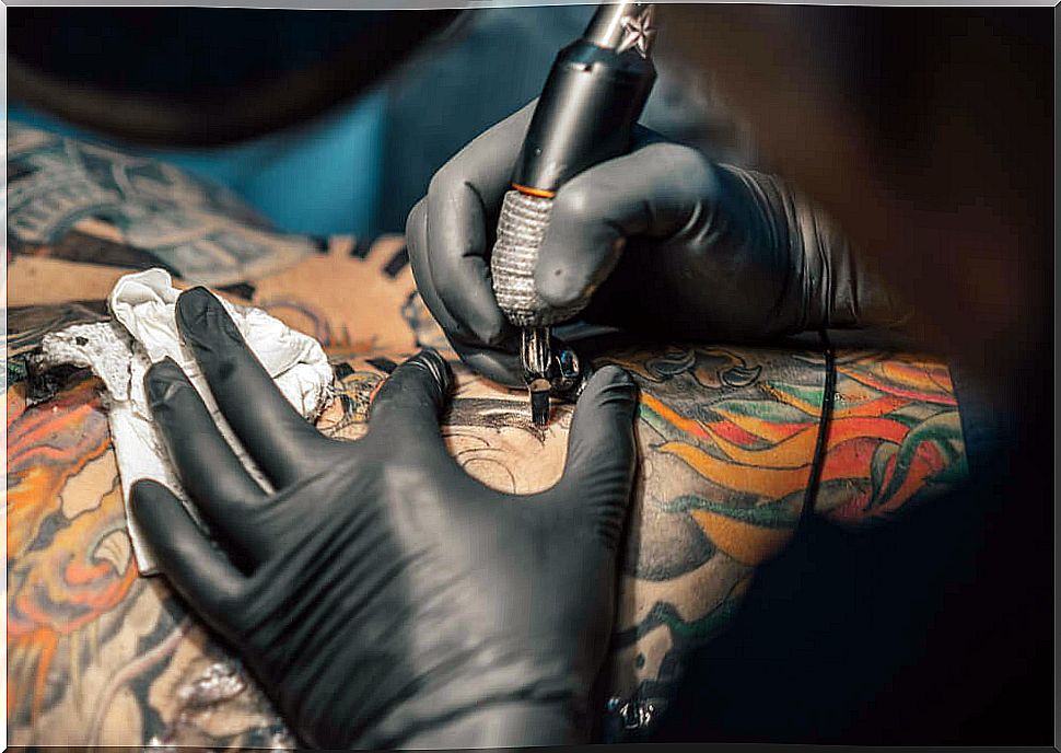 Tattoo artist doing a tattoo for the first time.