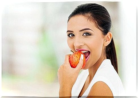 Woman eating an apple