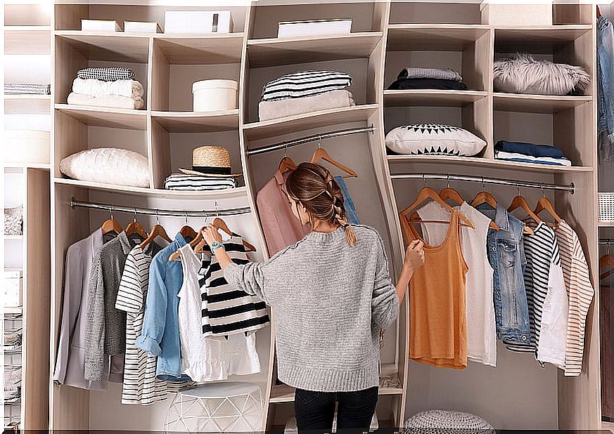 Woman organizing wardrobe