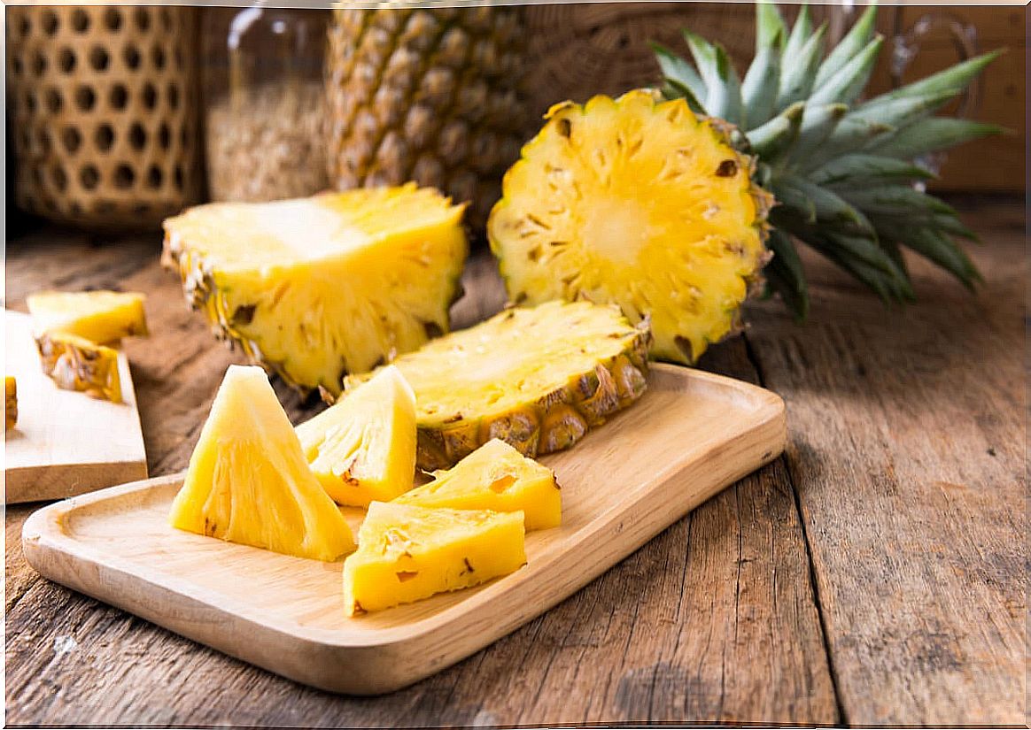 Pineapple fruit cut on a table.